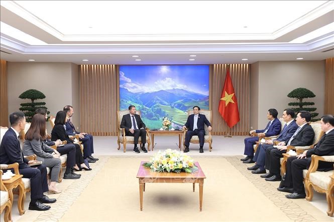 越南政府总理范明政会见阿迪达斯集团首席执行官卡斯帕·罗斯特 hinh anh 1