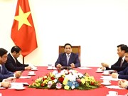 越南政府总理范明政同中国国务院总理李强通电话