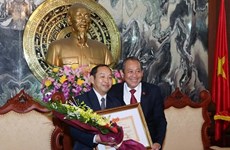 越南最高人民法院院长张和平会见老挝最高人民法院副院长坎潘·桑达拉