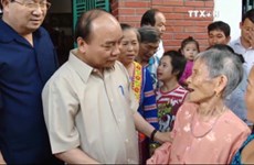 阮春福总理主持山罗水电站移民安置项目实施15周年总结会议
