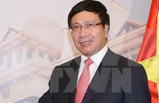 越南政府副总理兼外交部长范平明对老挝进行正式访问