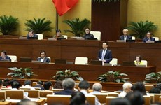 越南第十四届国会第八次会议：越南通信传媒部部长阮孟雄回答质询（组图）