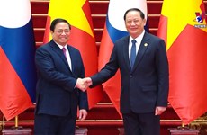 越南政府总理范明政对老挝进行正式访问