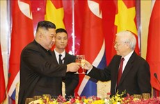 越共中央总书记、国家主席阮富仲举行宴会 欢迎朝鲜最高领导人金正恩 （组图）