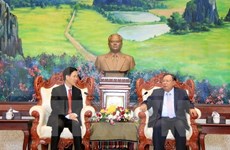 老挝人民革命党中央总书记、国家主席本扬·沃拉吉会见越共中央宣教部部长武文赏