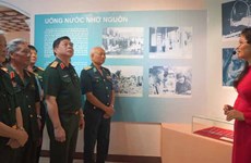 越南荣军烈士日70周年：“战友情义”图片资料展在河内开展