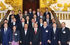 政府总理阮春福会见老挝人民革命党中央总书记本扬•沃拉吉