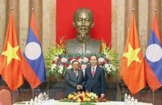 越南国家主席陈大光会见老挝人民革命党中央总书记、国家主席本扬·沃拉吉