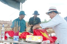 为在老挝牺牲的30具越南专家和志愿军遗骸举行归国仪式