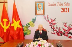 越共中央总书记、国家主席阮富仲与老挝人民革命党中央总书记通伦·西苏里通电话