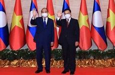 老挝媒体密集报道越南国家主席阮春福对老挝进行的正式友好访问