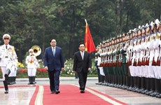 政府总理范明政主持仪式  欢迎老挝政府总理潘坎·维帕万访问越南