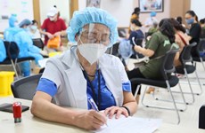 胡志明市为卫生所退休医生每月支付900万越盾的返聘工资