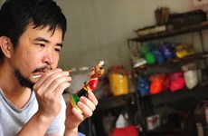 唐林古村艺人制作第31届东运会吉祥物--中南大羚雕像系列