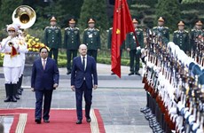 越南政府总理范明政举行仪式  欢迎德国总理对越南进行正式访问