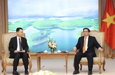 政府总理范明政会见老挝工贸部部长马来通·康马西