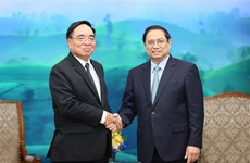 越南政府总理范明政会见老挝计划投资部长坎詹·冯福西一行