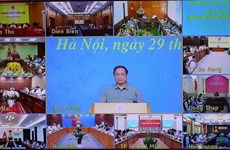 政府总理范明政：新冠肺炎疫情防控工作取得成功展现出越南精神、本领和智慧