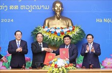 越南政府总理范明政与老挝总理宋赛·西潘敦共同主持越老政府间委员会第46次会议
