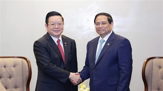 越南政府总理范明政会见东盟秘书长高金洪
