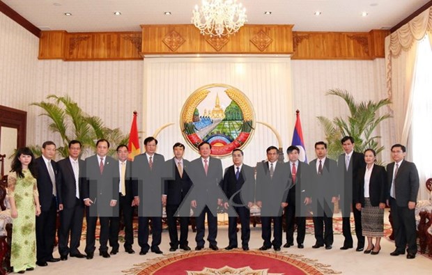 老挝总理高度评价越老挝两国最高人民检察院的合作 hinh anh 1
