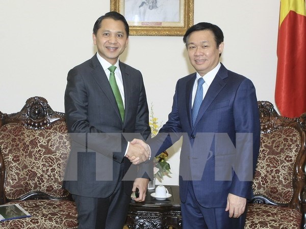 越南政府副总理王廷惠会见泰国开泰银行行长 hinh anh 1
