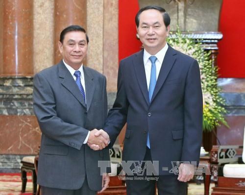 越南国家主席陈大光会见老挝国家主席办公厅主任蓬塔迪 hinh anh 1