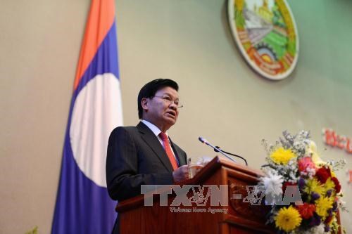 老挝总理通伦·西苏里呼吁改善投资环境 hinh anh 1