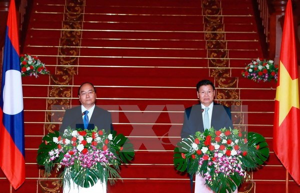 越老建交55周年：老挝总理通伦对两国关系的发展表示满意 hinh anh 1