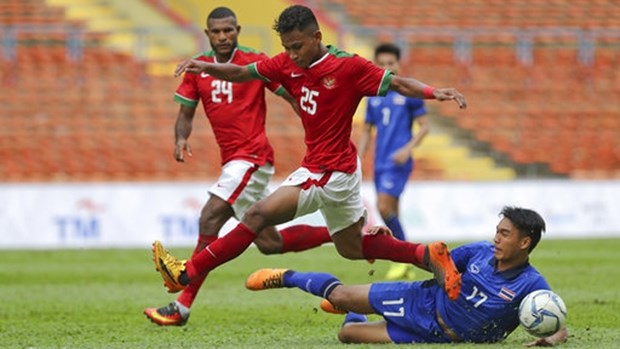 第29届东南亚运动会男足比赛：泰国队和印度尼西亚队1-1战平 hinh anh 1