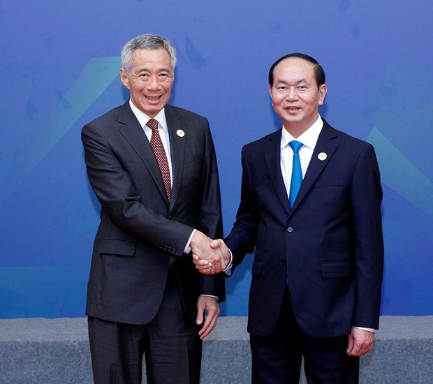 越南国家主席陈大光会见新加坡总理李显龙 hinh anh 1