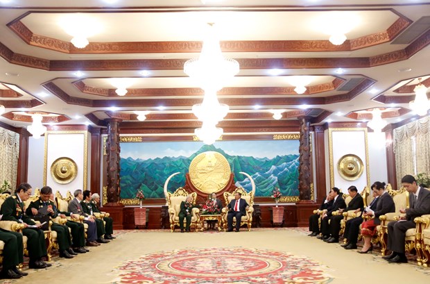 老挝领导人高度评价越南援老志愿军和军事专家的巨大贡献 hinh anh 2