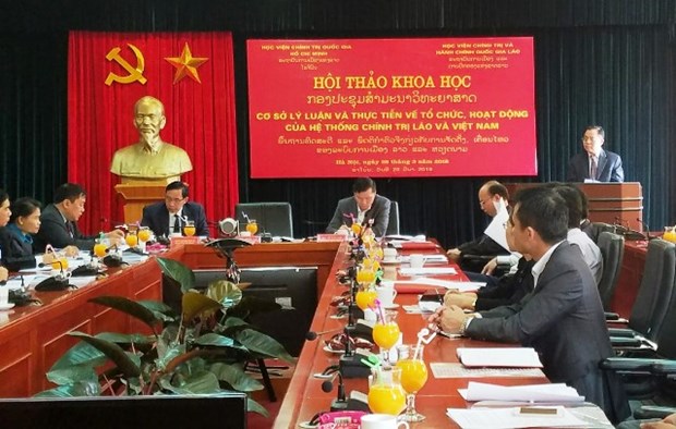 越南与老挝分享政治系统运行经验 hinh anh 1