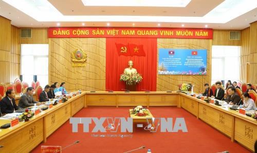 越南公安部同老挝安全部加强群众团体工作的合作 hinh anh 1