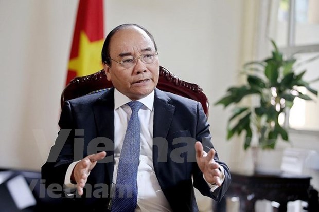 越南政府总理阮春福接受新加坡海峡时报的专访 hinh anh 1