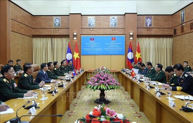 老挝国防部部长占沙蒙大将对越南进行工作访问 hinh anh 2
