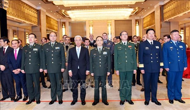 越南人民军建军75周年和全民国防日30周年纪念典礼在中国举行 hinh anh 2