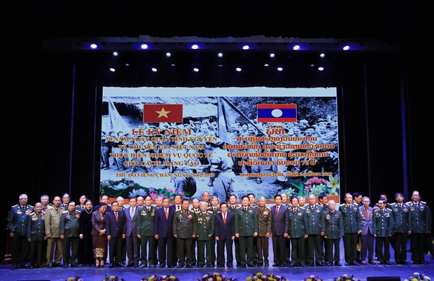 援老越南志愿军和专家传统日70周年纪念活动在万象隆重举行 hinh anh 3