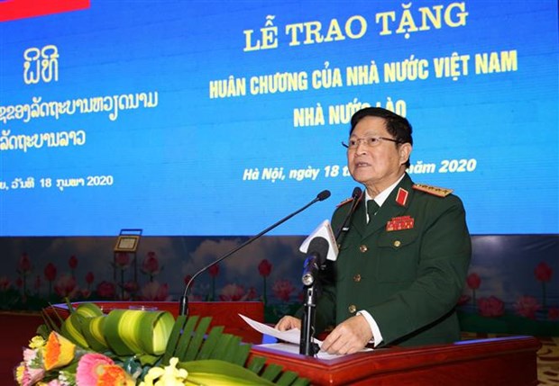越南和老挝两国国家勋章授勋仪式在河内隆重举行 hinh anh 2