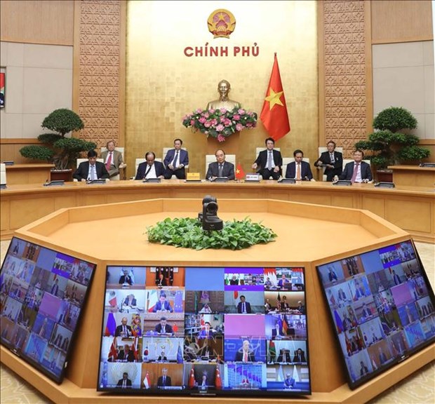越南政府总理出席应对新冠肺炎疫情的G20视频峰会 hinh anh 1