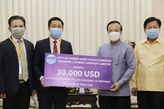 越南企业与老挝政府携手共同抗击新冠肺炎疫情 hinh anh 1