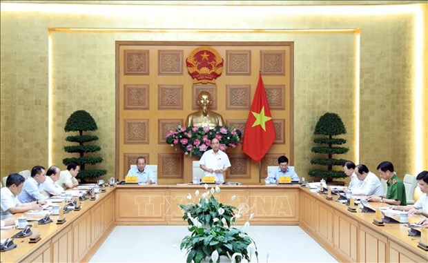 越南政府总理主持会议 为石油和航空企业化解困难 hinh anh 1