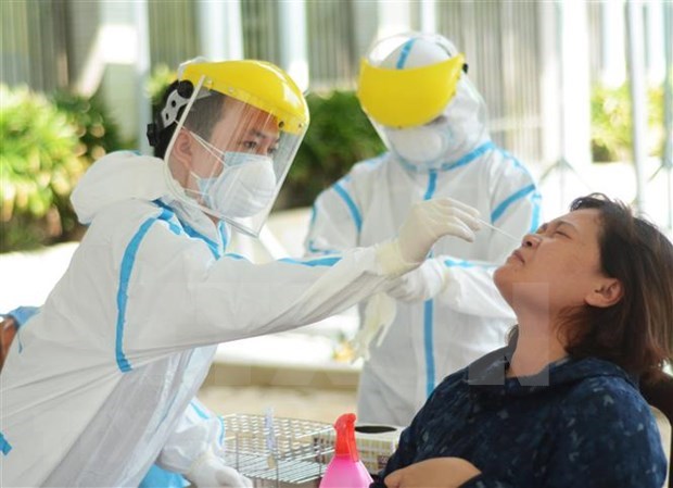 俄媒：越南政治体系在新冠肺炎疫情防控中有效运行 hinh anh 1