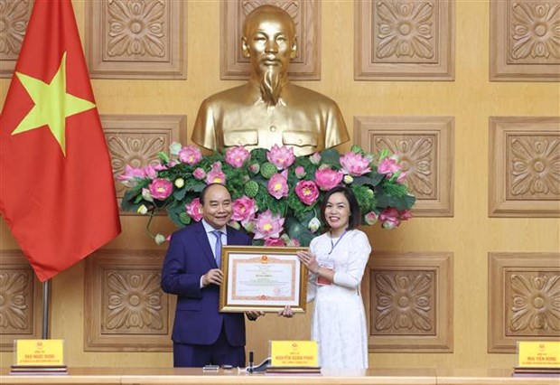 越南政府总理阮春福出席“为社会默默奉献的先进人物” 表彰大会 hinh anh 2