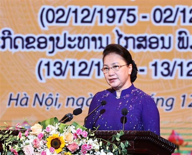 老挝人民民主共和国国庆45周年暨凯山·丰威汉主席诞生100周年纪念典礼在河内举行 hinh anh 2