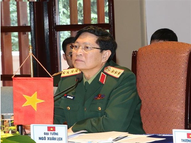 越南与老挝国防部签署2021年合作计划 hinh anh 2