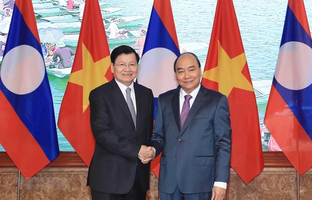 老挝总理通伦访问越南并共同主持召开越老政府间联合委员会会议 hinh anh 1
