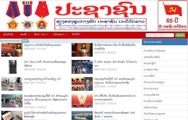越共十三大： 老挝媒体高度评价越南社会主义共和国建设道路 hinh anh 1