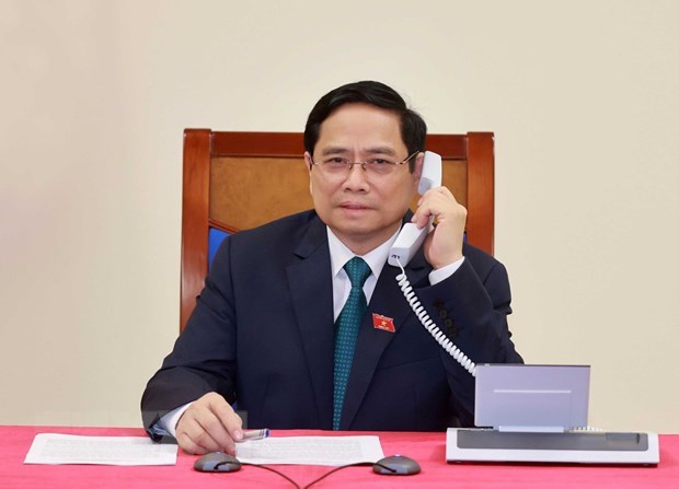 老挝总理潘坎·维帕万与越南新任政府总理范明政通电话表示祝贺 hinh anh 1