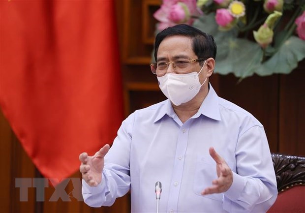 政府总理范明政：卫生部要攻坚克难，把人民群众健康安全摆在首要位置 hinh anh 1
